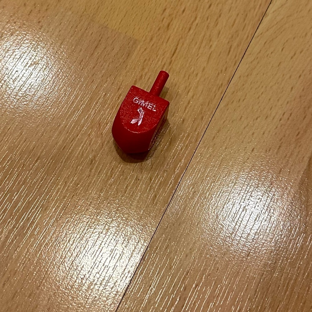 Small red wooden dreidel